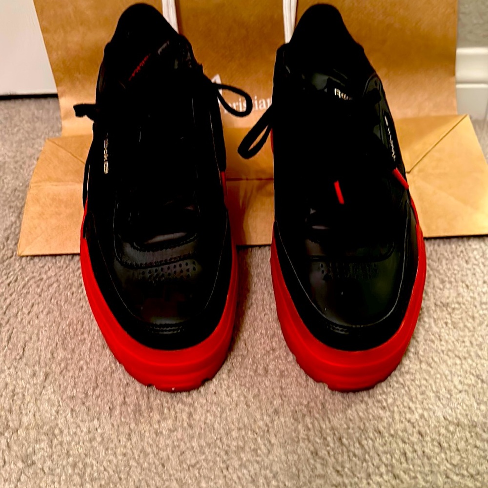 Cardi B Reebok athletic shoes. black/red